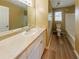Clean bathroom featuring a vanity with ample counter space, tile flooring, and a combined tub and shower at 1960 Banks Way, Atlanta, GA 30349