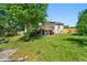 Expansive backyard features a deck, lush greenery, and a wooden fence at 2172 Oakland Ridge Dr, Lawrenceville, GA 30044