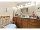 Bathroom with oak cabinetry, vanity, and a neutral color scheme at 2172 Oakland Ridge Dr, Lawrenceville, GA 30044