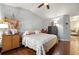 Comfortable bedroom featuring hardwood floors, ceiling fan, and neutral tones, creating a relaxing atmosphere at 2172 Oakland Ridge Dr, Lawrenceville, GA 30044