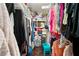 Spacious walk-in closet with ample storage and organization options at 2172 Oakland Ridge Dr, Lawrenceville, GA 30044