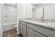 Bathroom featuring double vanity with granite countertop and white cabinets at 342 Overlook Rd, Covington, GA 30014