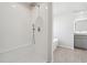 Modern bathroom with walk-in shower, bench, and glass enclosure, next to a large bathtub at 342 Overlook Rd, Covington, GA 30014