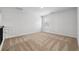 Empty bedroom features neutral carpet and a window overlooking the backyard at 342 Overlook Rd, Covington, GA 30014