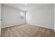 Bright, carpeted bedroom with a large window offering plenty of natural light at 342 Overlook Rd, Covington, GA 30014