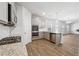 Modern kitchen featuring stainless steel appliances, granite countertops, and wood-look flooring at 342 Overlook Rd, Covington, GA 30014