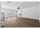 Bright, open living room featuring stylish wood-look floors, neutral walls, and a modern ceiling fan, offering a versatile space at 342 Overlook Rd, Covington, GA 30014