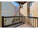 Exterior view of a wooden balcony with wood railings overlooking the tree tops in the backyard at 735 Ponce De Leon Pl Ne Unit 1, Atlanta, GA 30306