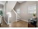 Open entryway with gleaming hardwood floors and natural light from adjacent windows at 735 Ponce De Leon Pl Ne Unit 1, Atlanta, GA 30306