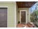 Home's front door is adorned with plants, a brick walkway, and a small covered porch at 735 Ponce De Leon Pl Ne Unit 1, Atlanta, GA 30306