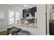Modern kitchen featuring granite countertops, breakfast bar, stylish backsplash, and stainless steel appliances at 735 Ponce De Leon Pl Ne Unit 1, Atlanta, GA 30306