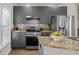 Modern kitchen with stainless steel appliances, granite countertops, and stylish backsplash at 735 Ponce De Leon Pl Ne Unit 1, Atlanta, GA 30306