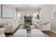 Inviting living room with a fireplace, neutral furniture, and natural light at 735 Ponce De Leon Pl Ne Unit 1, Atlanta, GA 30306