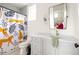 Contemporary bathroom showcasing a patterned shower curtain and a grey vanity at 1126 Mado Loop, Chattahoochee Hills, GA 30268
