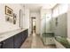 Modern bathroom featuring dual sinks, a walk-in shower, and a soaking tub at 1126 Mado Loop, Chattahoochee Hills, GA 30268