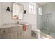 Modern bathroom featuring a glass shower, marble countertop, and stylish fixtures at 1126 Mado Loop, Chattahoochee Hills, GA 30268