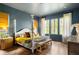Stylish bedroom with four-poster bed and natural light at 1126 Mado Loop, Chattahoochee Hills, GA 30268