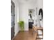 Bright entryway with hardwood floors, white walls, and stylish console table with lamps at 1126 Mado Loop, Chattahoochee Hills, GA 30268