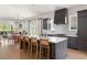 Open-concept kitchen features a large island, modern appliances, and sleek cabinetry at 1126 Mado Loop, Chattahoochee Hills, GA 30268