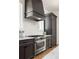 Well-equipped kitchen with stainless steel appliances and ample counter space for cooking at 1126 Mado Loop, Chattahoochee Hills, GA 30268