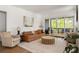 Cozy living room with stylish furnishings and access to outdoor deck at 1126 Mado Loop, Chattahoochee Hills, GA 30268