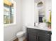 Well-lit powder room featuring modern fixtures and stylish decor at 1126 Mado Loop, Chattahoochee Hills, GA 30268
