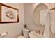 Stylish powder room features decorative art, vessel sink, and ample lighting at 335 Wyehwood Ct, Alpharetta, GA 30022