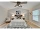Bright bedroom features a ceiling fan, vaulted ceilings, and hardwood floors at 335 Wyehwood Ct, Alpharetta, GA 30022
