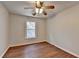 Bedroom with hardwood floors, a ceiling fan and a window providing natural light at 335 Wyehwood Ct, Alpharetta, GA 30022