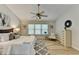 Bedroom features a ceiling fan, three windows, and light hardwood floors at 335 Wyehwood Ct, Alpharetta, GA 30022