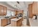 Spacious kitchen with center island, stainless steel appliances, and view into dining room at 335 Wyehwood Ct, Alpharetta, GA 30022