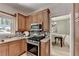 Well-appointed kitchen with stainless steel appliances and view into the formal dining room at 335 Wyehwood Ct, Alpharetta, GA 30022