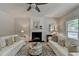 Bright living room with hardwood floors, a fireplace, and neutral decor at 335 Wyehwood Ct, Alpharetta, GA 30022