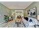 Cozy living room with a dining area, providing ample seating and natural light at 335 Wyehwood Ct, Alpharetta, GA 30022