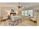 Spacious main bedroom with ceiling fan, hardwood floors, and large windows at 335 Wyehwood Ct, Alpharetta, GA 30022