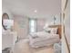 Serene bedroom with a plush bed, soft lighting, and stylish decor at 505 Altamaha Court, Locust Grove, GA 30248