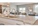 Spacious kitchen with stainless appliances, granite counters, and an open floor plan at 505 Altamaha Court, Locust Grove, GA 30248
