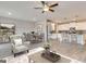 Inviting open-concept living space with hardwood floors, a kitchen island, and a dining area at 505 Altamaha Court, Locust Grove, GA 30248