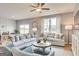 Comfortable living room features a ceiling fan, modern furniture, and an open layout at 505 Altamaha Court, Locust Grove, GA 30248