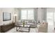 Bright living room boasts elegant decor, a comfortable sofa, and ample natural light at 505 Altamaha Court, Locust Grove, GA 30248