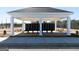 Community mailboxes are sheltered by a pavilion featuring white columns and a concrete floor at 505 Altamaha Court, Locust Grove, GA 30248