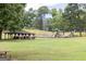Community park offers playground, picnic tables, and an expansive green lawn with mature trees at 505 Altamaha Court, Locust Grove, GA 30248