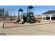 Community playground featuring slides, climbing structures, a pavilion, and a safety-approved ground cover at 505 Altamaha Court, Locust Grove, GA 30248