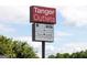 Tanger Outlets sign identifies nearby shopping with brand name retailers at 505 Altamaha Court, Locust Grove, GA 30248