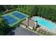 Aerial view of community pool, tennis courts, and clubhouse, offering a resort-style living experience at 1442 Valley Glen Way, Dunwoody, GA 30338