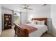 Cozy bedroom with a window, white walls, and wood furniture at 1442 Valley Glen Way, Dunwoody, GA 30338