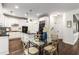 Spacious kitchen featuring white cabinets, dark countertops, stainless steel appliances, and an island with seating at 1442 Valley Glen Way, Dunwoody, GA 30338