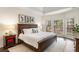 Spacious main bedroom with a large bed and windows at 1442 Valley Glen Way, Dunwoody, GA 30338