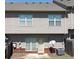 View of the back of the house with vinyl siding and an AC unit on the lawn at 2162 Oakland Grove Pl, Lawrenceville, GA 30044