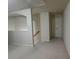 Bright hallway with neutral walls and carpet, leading to a doorway at 2162 Oakland Grove Pl, Lawrenceville, GA 30044